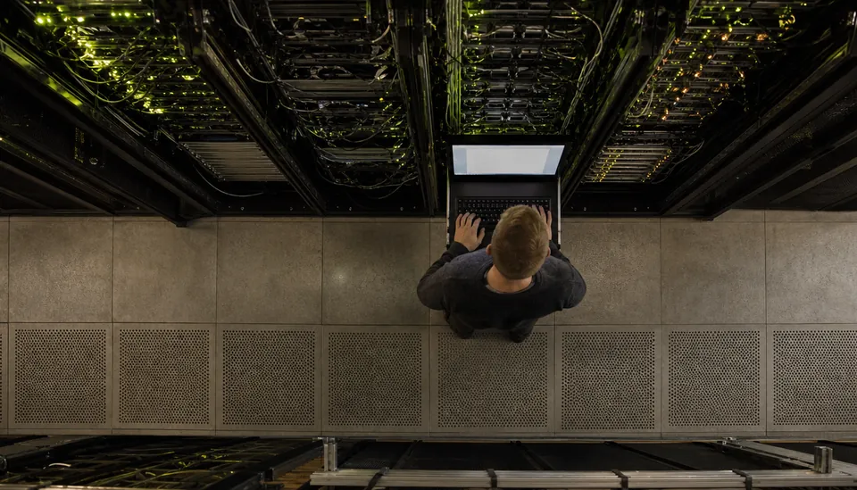 Eye-level view of a server room with blinking network equipment